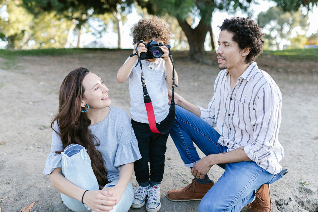 Photographer editing a candid photo of a child